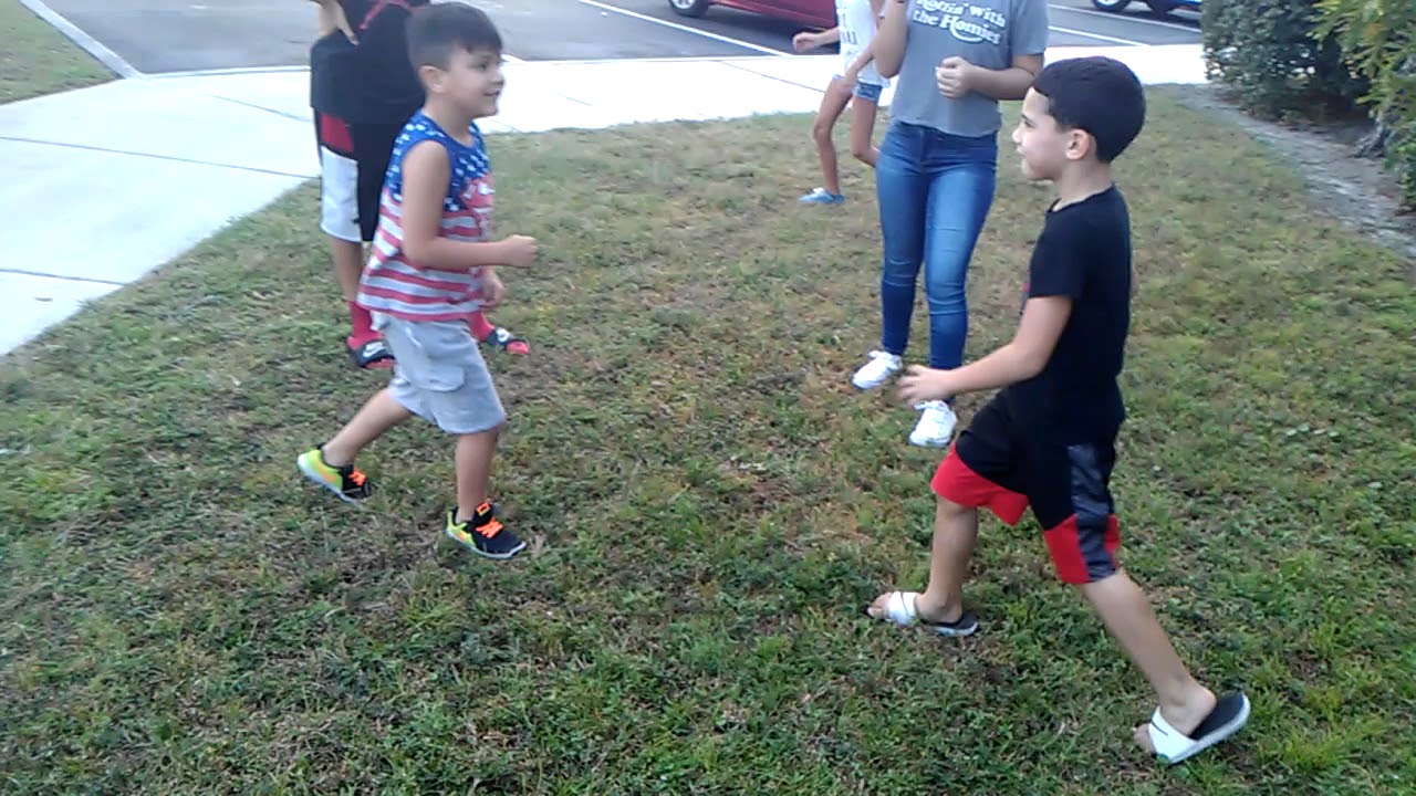 Little kid fight the one in the American shirt gets drop 