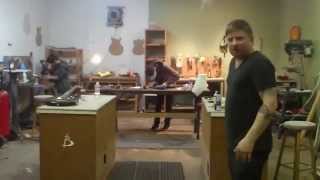 Artie laughs at dad at guitar work shop