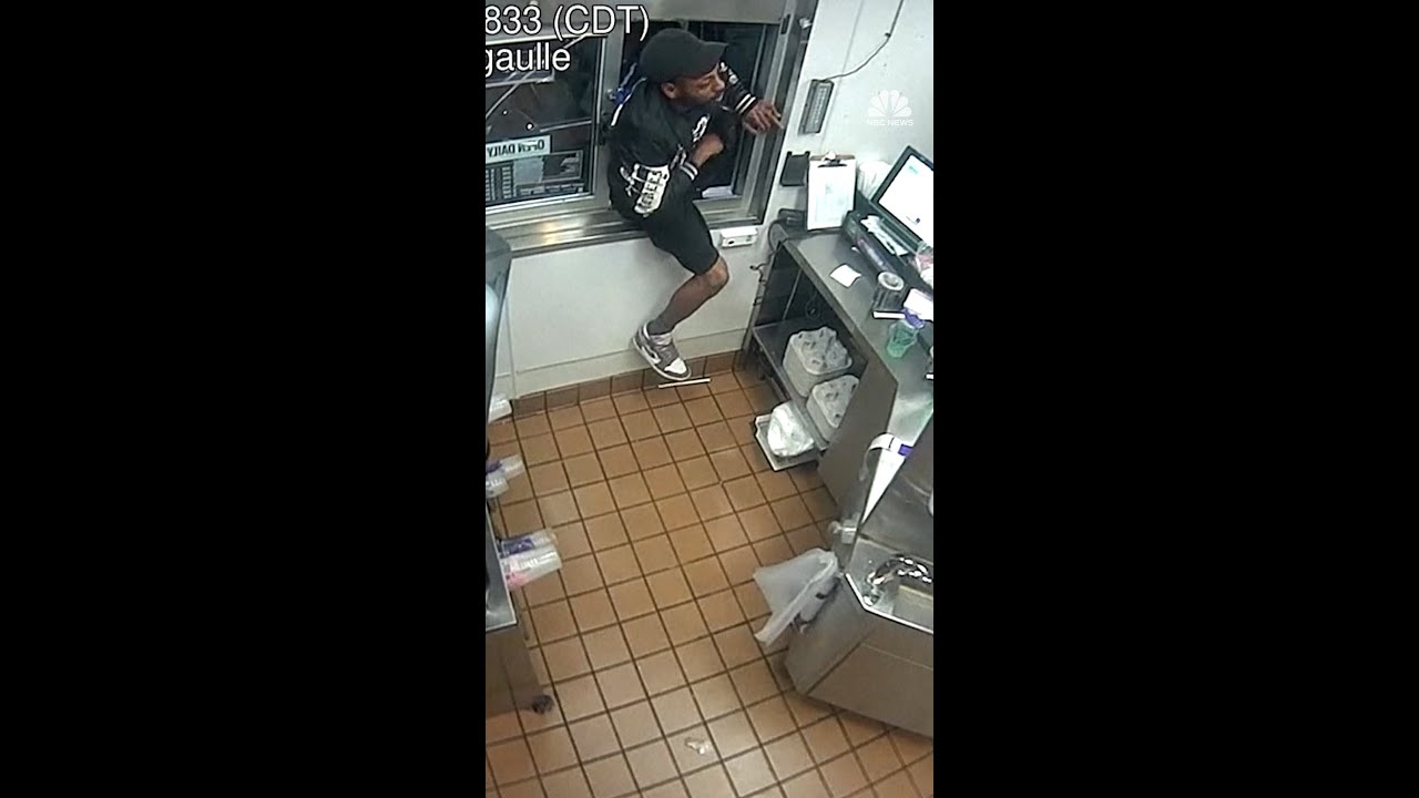 Man climbs through Taco Bell drive-thru with a gun Man climbs through Taco Bell drive-thru with a gun
