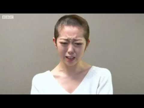 AKB48 pop star shaves head after breaking band rules