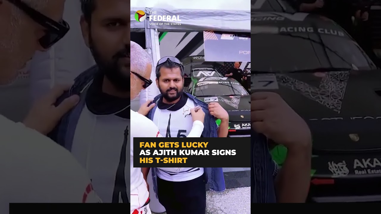 Actor Ajith Kumar signs for a fan on his T-Shirt