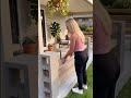 the process of making a fence on the terrace of a house using large bricks and wooden beams #popular