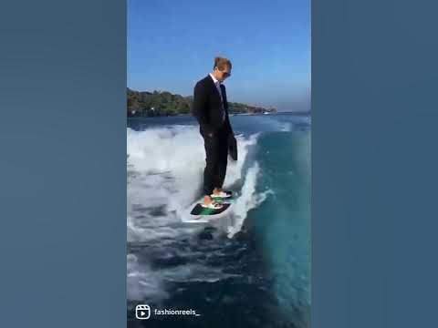 Man surfing In suit #shorts - YouTube