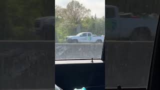 2 Nassau County highway patrol cars assisting a disabled driver