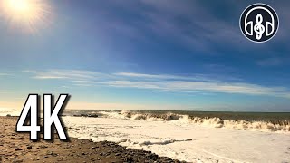 A storm on the Black Sea beach with waves crashing on rocks.