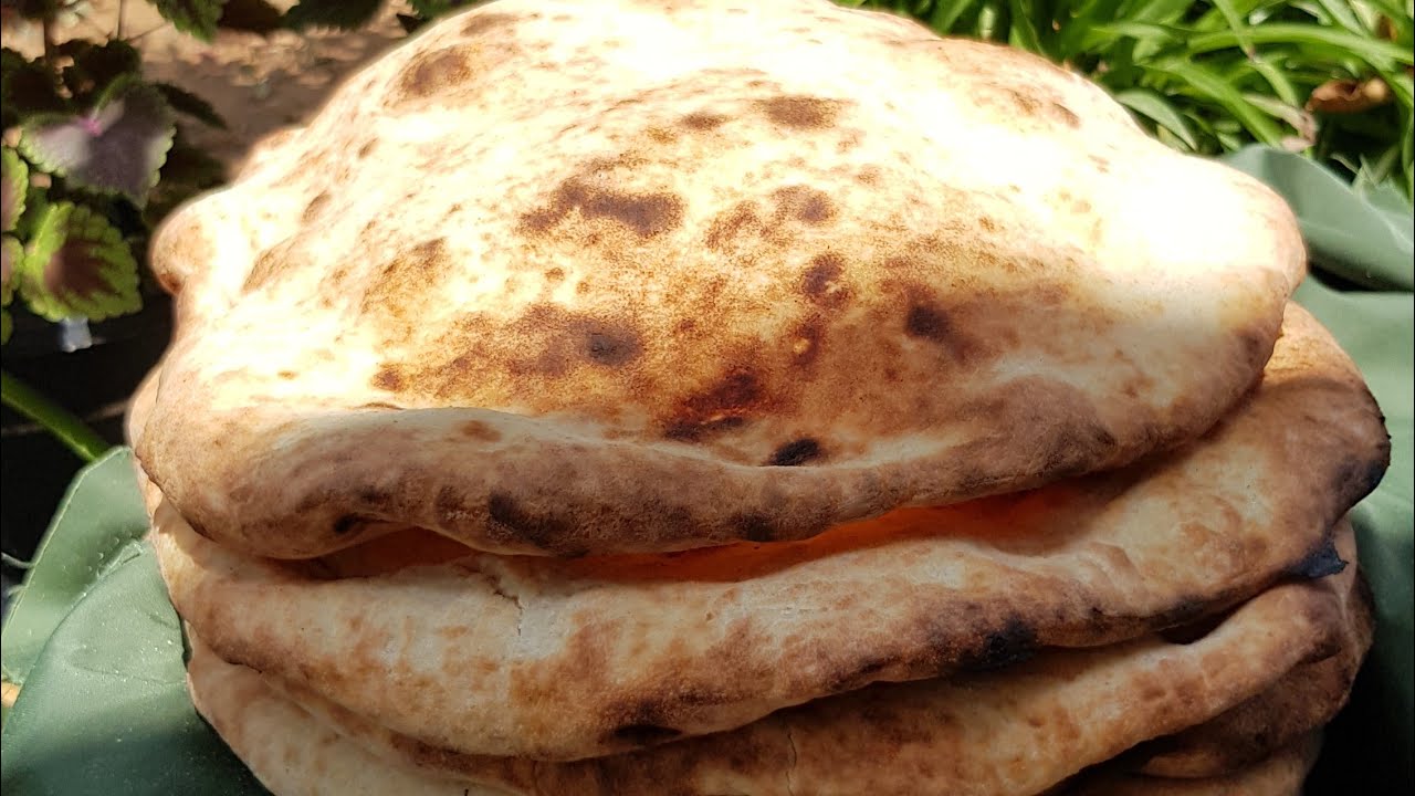 #خبز على طابون الحطب بنكهه فلسطينيه  بعجينه رائعه وقطنيه