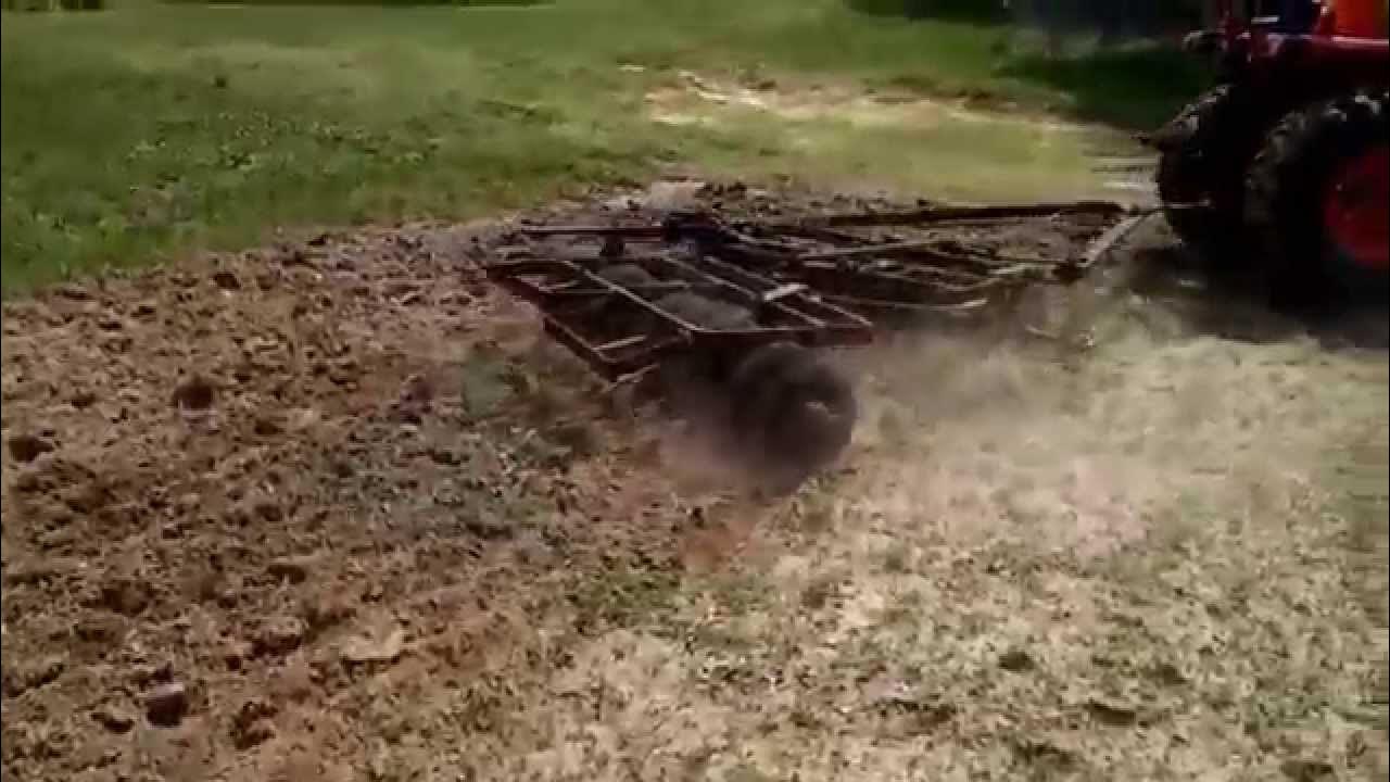 Kubota l2501 disking with 22 disk harrow YouTube