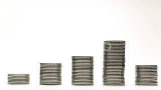 Silver Coins on Stacks Are Decrease on White Background Stop Motion Animation | Stock Footage - ...
