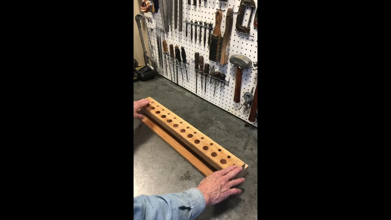 Homemade valve lifter and pushrod storage rack for a Toyota FJ40