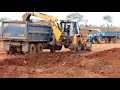 Kirlosker JCB Backhoe Loading Mud In Tata Tipper,  Sonalika Rx 35 and Farmtrac