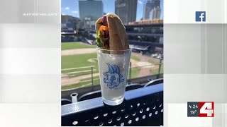 Kent Ehrhardt, Cameron Bopp try Hartford Yard Goats' hot dog submerged in goat milk