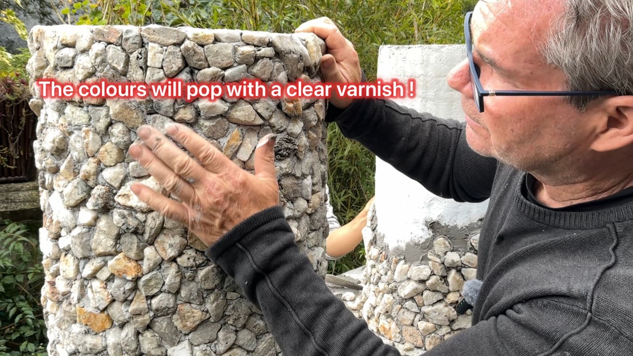 Decorating a cylindrical cement planter with river rocks !