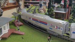 Amtrak F7 #100, and Norfolk Southern #8119 hauling coal. 