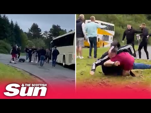 Shocking moment Rangers &amp; Hearts fans clash after supporters’ buses stop at service station