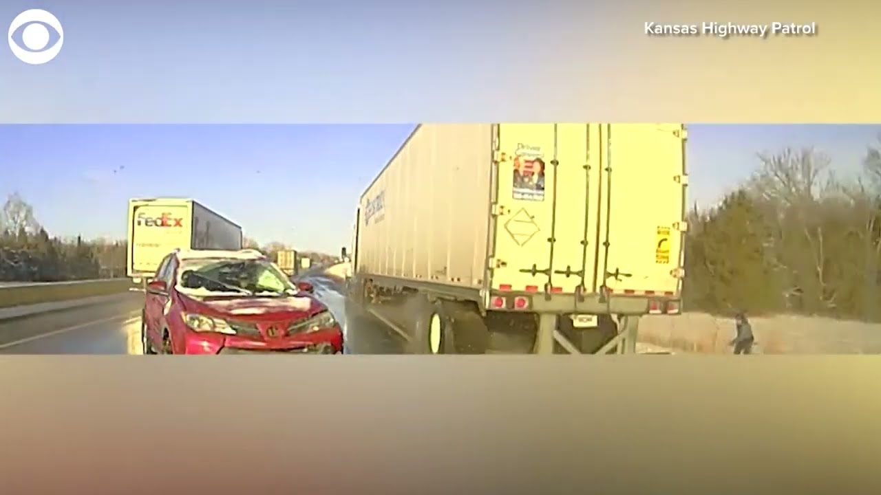 Highway patrol trooper narrowly avoids being hit by semi-truck