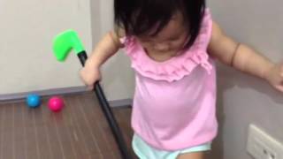 bianca playing golf in playroom