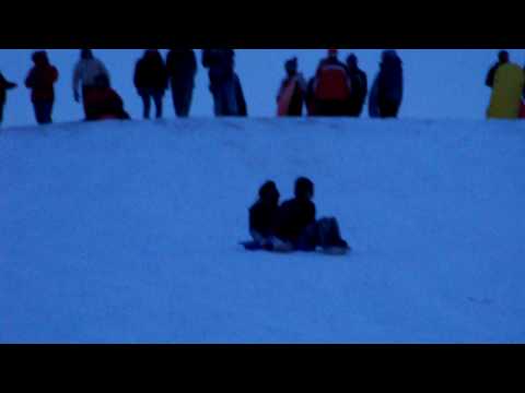 Pierre and Brenda Sledding Bottom Hill View