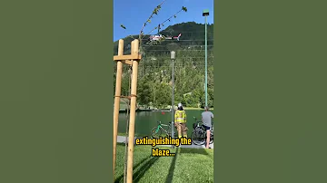 Helicopter Dumps Bucket Of Water On Wildfire 