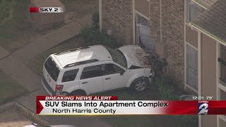 Woman driving with cast on foot crashes SUV into several vehicles, apartment