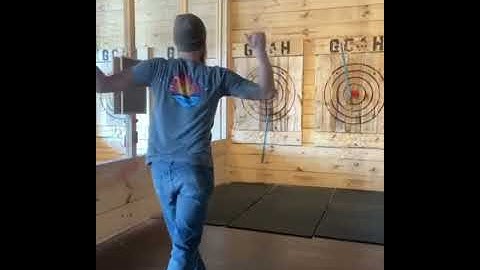 Man Shows Trickshot By Throwing Two Axes Simultaneously Towards Target - 1182089
