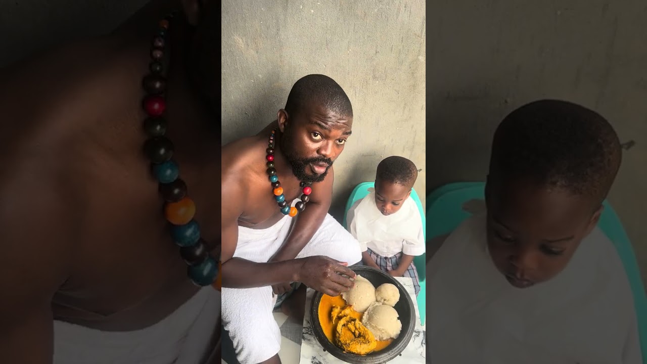 This is me and my son  we are eating eba  and egusi ￼😋😋￼￼