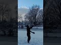 Dual-paddle pickleball vertical juggling in snow.