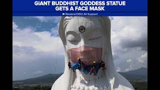 Giant Buddhist goddess statue gets a face mask
