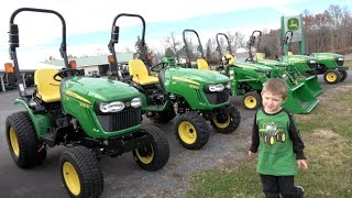 BOY LOVES JOHN DEERE TRACTOR DEALERSHIP