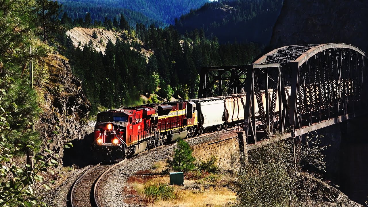 BUSY CANADIAN FREIGHT TRAINS WORKING THRU CISCO BRIDGES IN THE FRASER CANYON