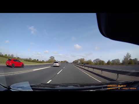 Dash cam captures close call after driver fails to check blind spot while emerging onto motorway