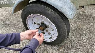 How to replace bearing dust cap with rubber plug grommet cover on small utility trailer axle