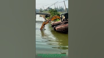 Amphibious Excavator Operates in River