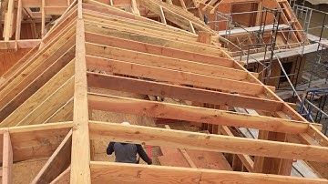 Unequal intersecting pitch roof.