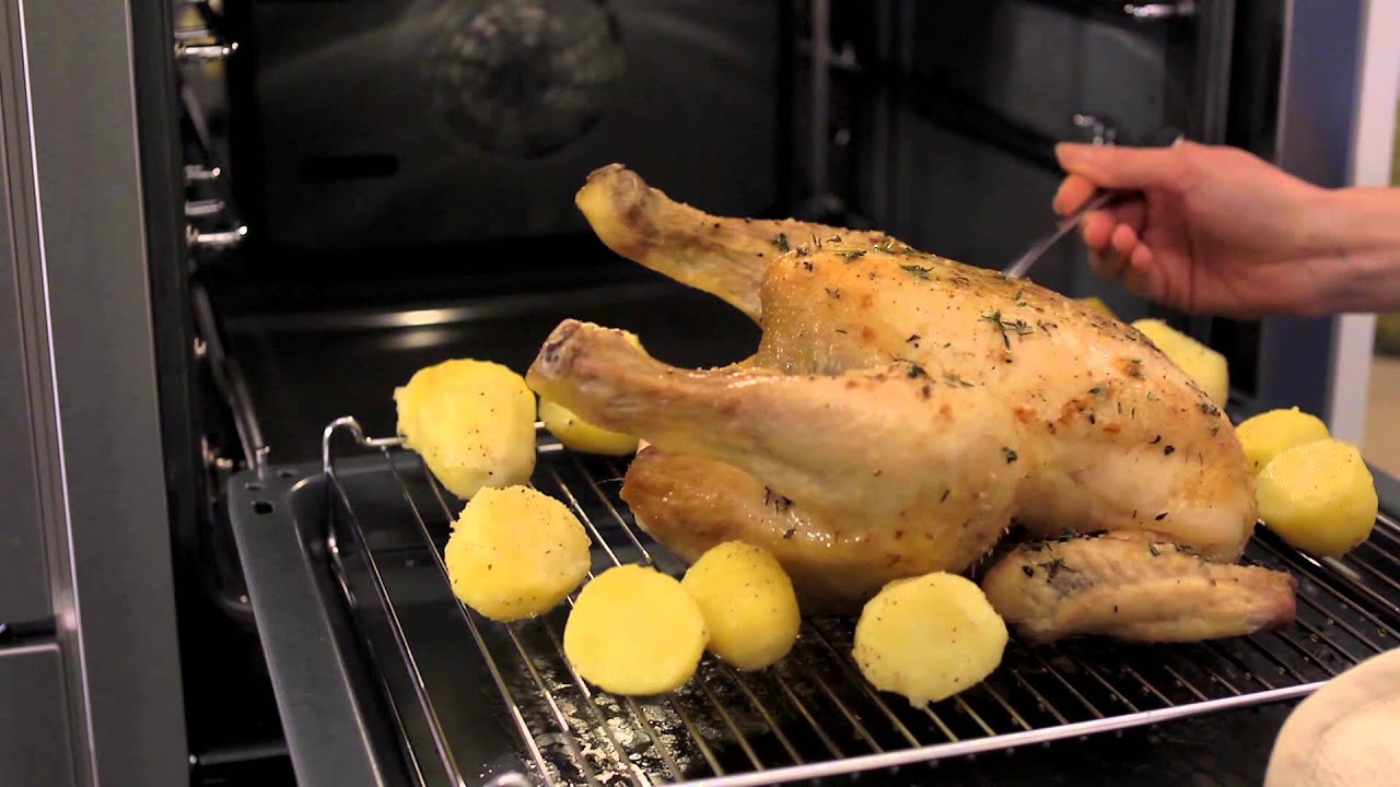 Open the door to a Slide&Hide oven by Neff