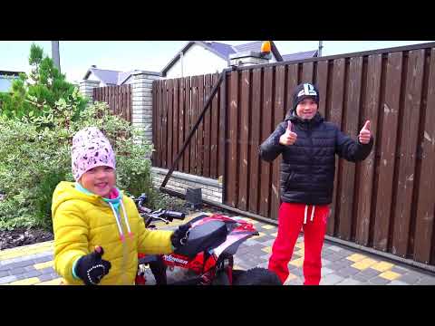 Alex on a quad bike helps a stuck tractor