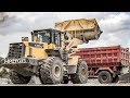 Wheel Loader Working Loading Dump Truck On Plant