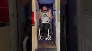 Guy in Wheelchair Does Pull-Ups in Doorway