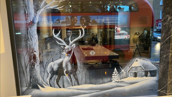 A fox in the snow. Window art using snow spray. #shopdisplay