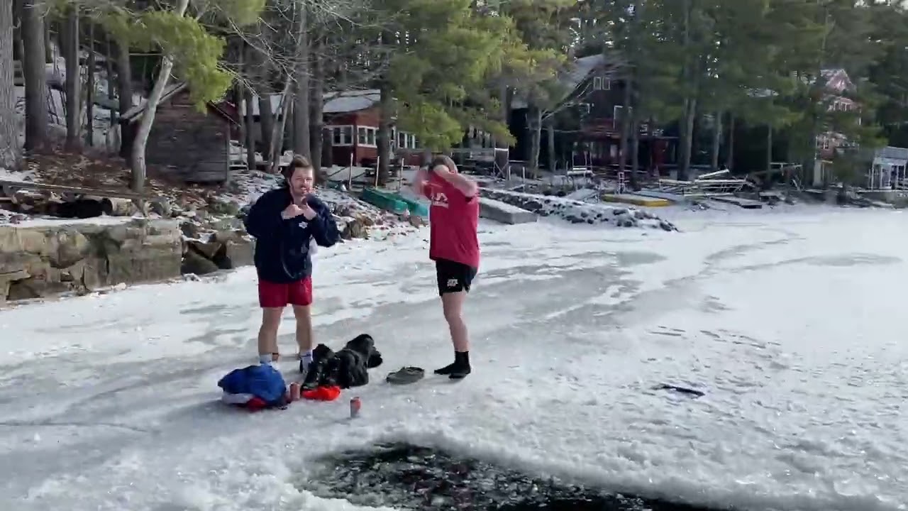 cutting a hole in the ice and then swimming with my brother and cousin in 2026