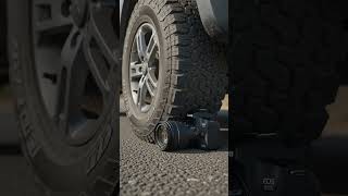Car tire rolls over Canon EOS #car
