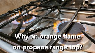 Our propane range top burns an orange flame ?!