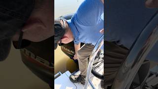 How do I trim the motor if the primary engine trim button isn’t working?