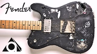 I refretted and cleaned up a worn and battered guitar.
