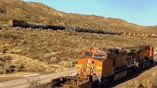 BNSF double header with empty well cars chases UNION PACIFIC mixed freighter at Cajon Pass (1 of 2)