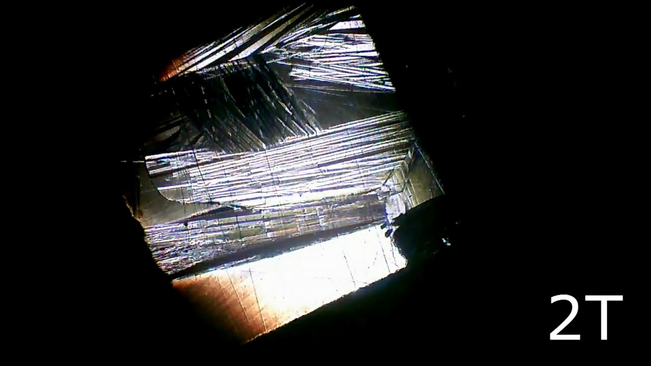 Surface of Heusler alloy NiMnSn in magnetic fields up to 14 T