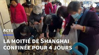 Covid: les habitants de Shanghai font leurs provisions avant le confinement | AFP