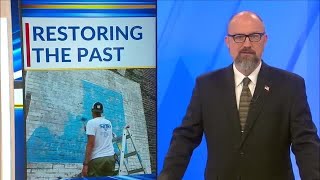 Artist Troy Freeman begins restoring historic Galena murals