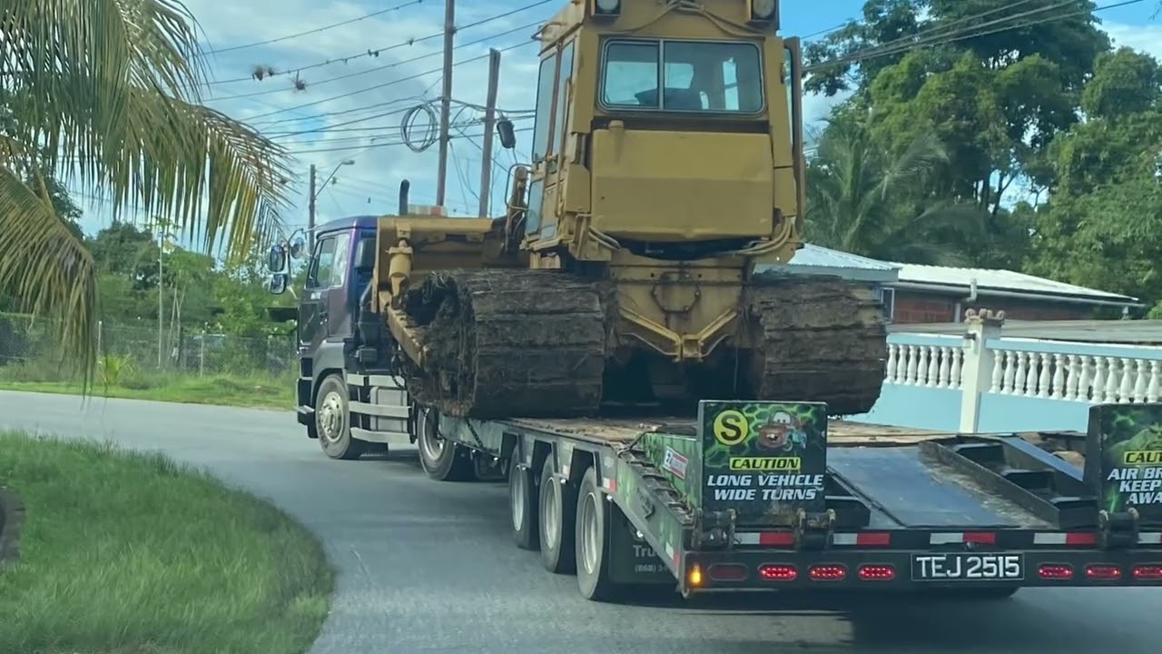 Moving a CAT D6D LGP bulldozer and 215C excavator