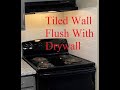 Tiled wall flush with drywall, see how I did it
