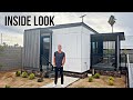 Bigger than expected inside a 320 square foot prefab home with robotic furniture